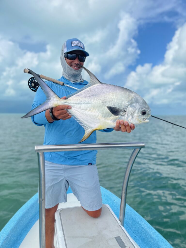 A fly fishermen caught a permit in Ascension Bay, Mexico.