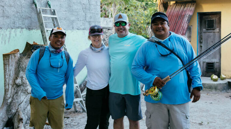 Jesus Marin Cauich and Eduardo Manuel Noh take a group photo before fly fishing.