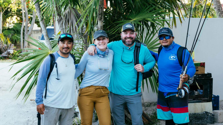 Nestor Mukul Xec and guests take a group photo before fly fishing.