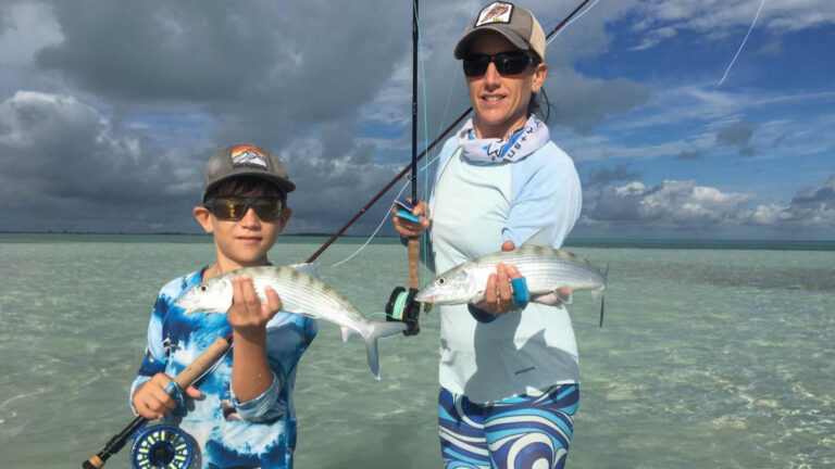Two fly fishermen catch a bonefish in Ascension Bay, Mexico.